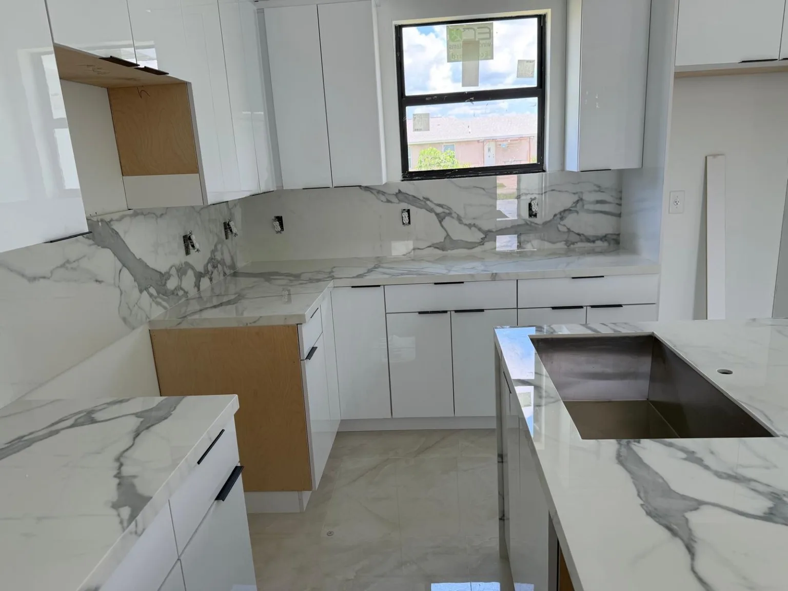 Kitchen cabinetry with stone countertops