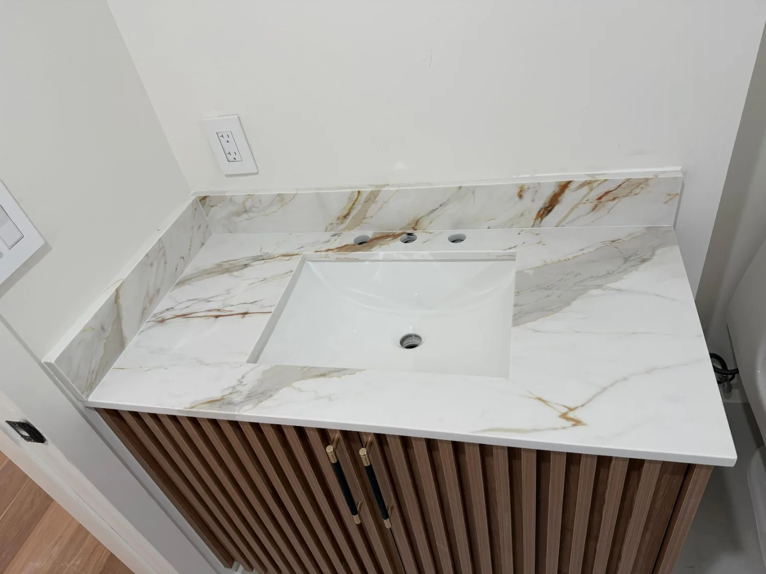 Bathroom vanity countertop detail with undermount sink