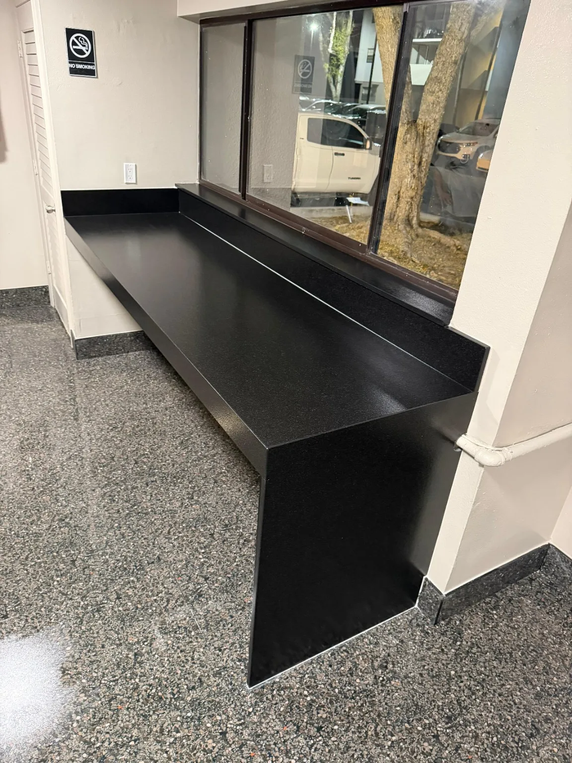 Custom commercial cabinetry with black countertop