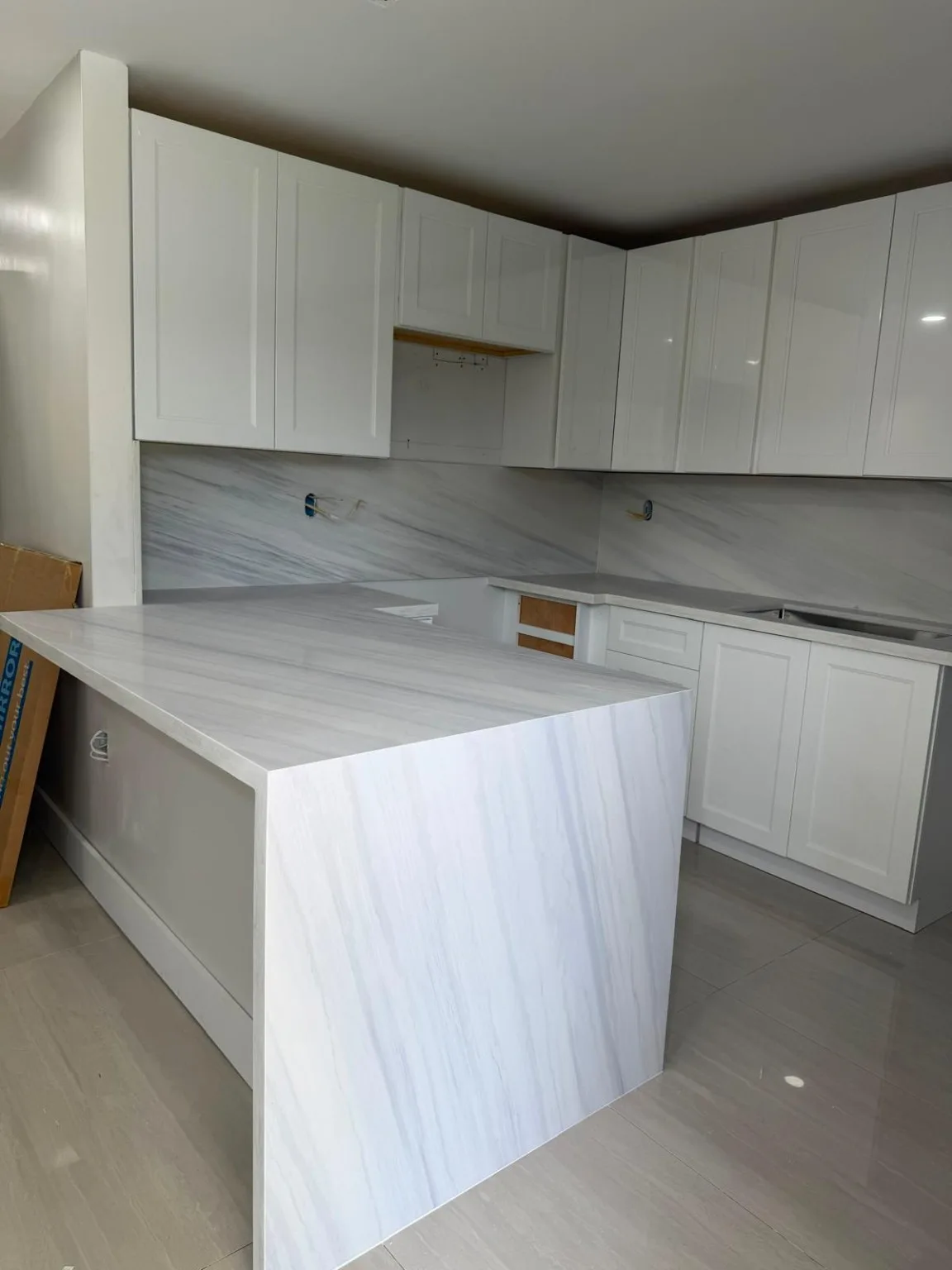 Kitchen waterfall countertop installation