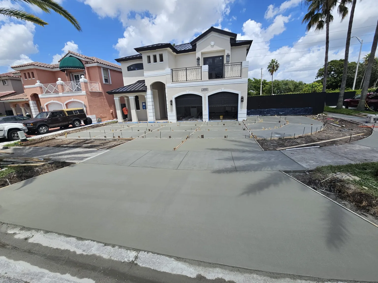 Freshly poured concrete driveway with wooden forms during construction