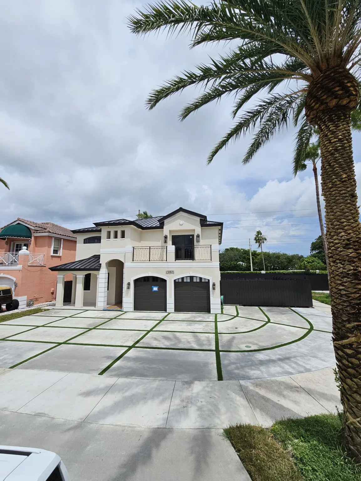 Concrete driveway and exterior flatwork on a Miami-Dade home completed by JT Express Solutions